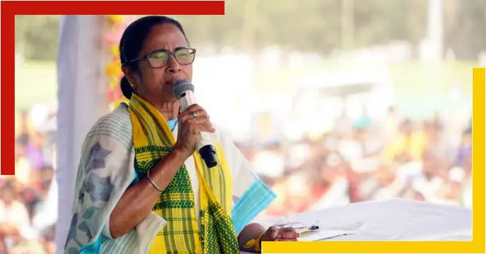 Image of Mamata Banerjee, the Chief Minister of West Bengal, standing in front of a microphone