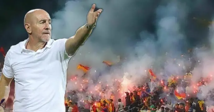 Antonio Lopez Habas, renowned football coach, standing on the sidelines of a football field