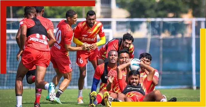 East Bengal football club players celebrating a goal
