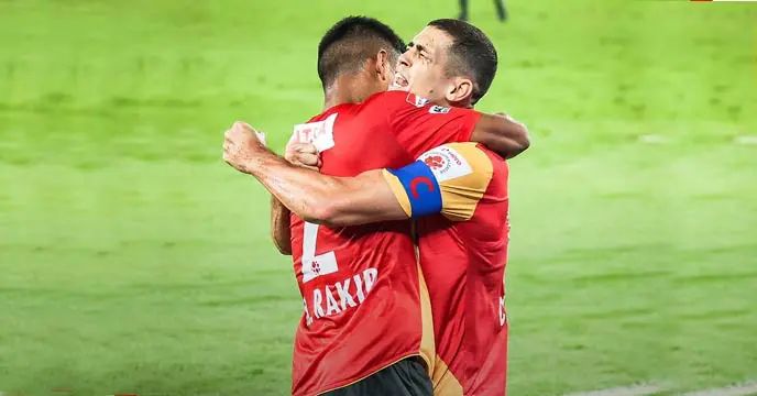 East Bengal's football team celebrates a victory on the field