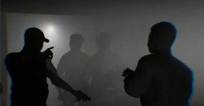 Image of a protest in Bangladesh with people holding up signs and chanting slogans.