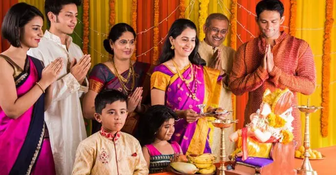 Akshaya Tritiya puja offerings with flowers, fruits, and sweets