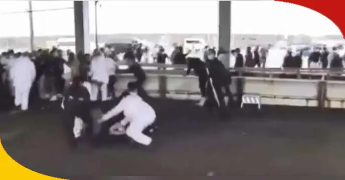 Japanese Prime Minister Kishida waving at a crowd