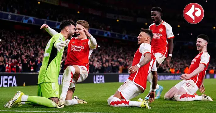 Arsenal players race towards their goalkeeper David Raya after his second shootout save sealed their Champions League progress