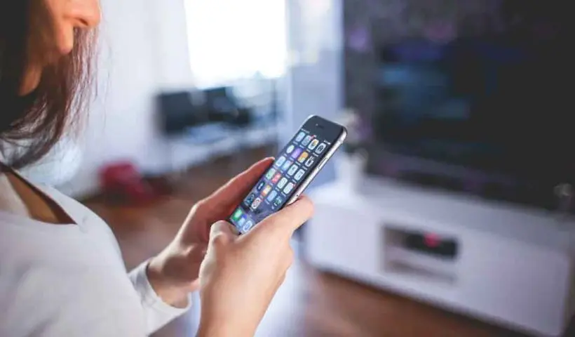 Woman Wearing White V Neck Shirt Using Spac Iphone