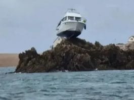 Boat gets stuck 10 feet on top of a rock