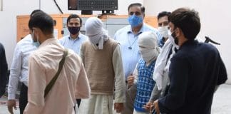 suspected terrorists being taken to the Anti-Terror Cell