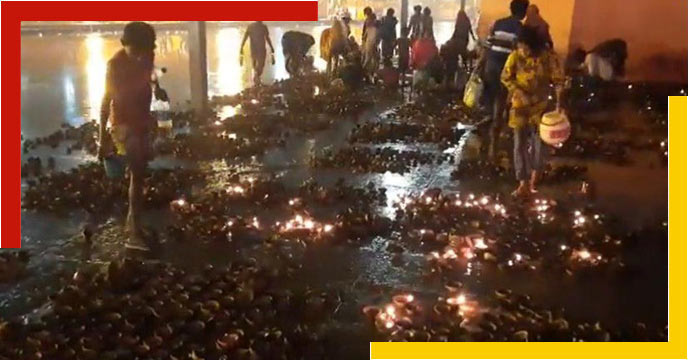 People collect residual oil from earthen lamps after Diwali celebration