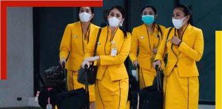 An Indian air hostess wearing a face mask and shield to protect against COVID-19