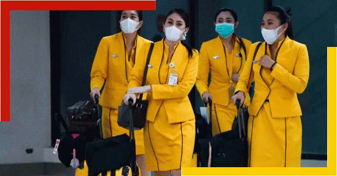 An Indian air hostess wearing a face mask and shield to protect against COVID-19