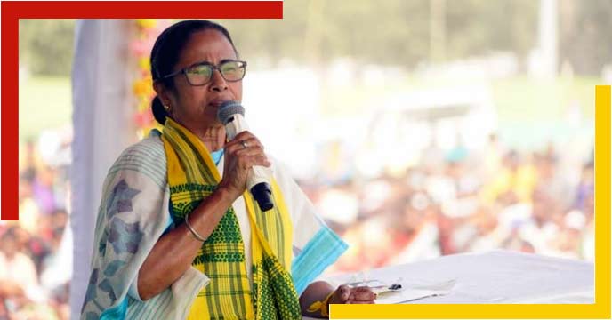 Image of Mamata Banerjee, the Chief Minister of West Bengal, standing in front of a microphone