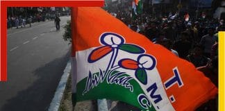 TMC logo with flowers in the background