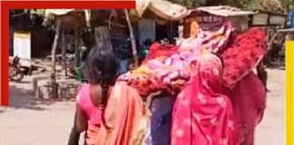 Women Carry Relative’s Body