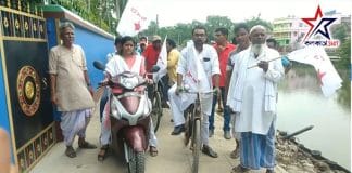 Meenakshi Mukherjee's bike procession in front of Anis Khan's house