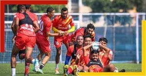 East Bengal football club players celebrating a goal