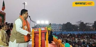 Suvendu Adhikari addressing a rally with a microphone in hand
