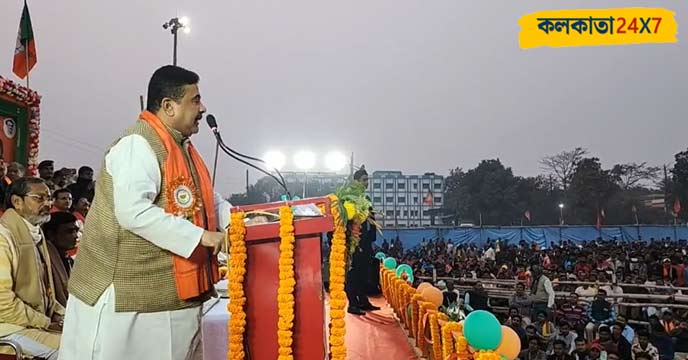 Suvendu Adhikari addressing a rally with a microphone in hand