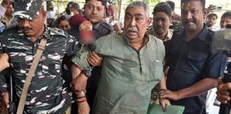 Anubrata Mandal, TMC leader, surrounded by police personnel