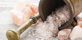 Himalayan rock salt crystals on a wooden spoon