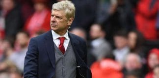 Popular Coach Arsene Wenger posing for the camera