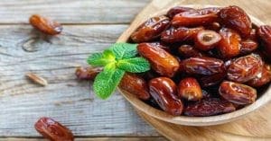 A plate of dates with a caption that reads 'Discover the Power of Dates for Combating Brain Problems
