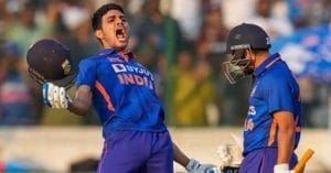 Shubman Gill playing cricket with a bat and helmet on a green field