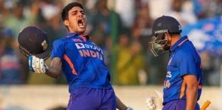 Shubman Gill playing cricket with a bat and helmet on a green field