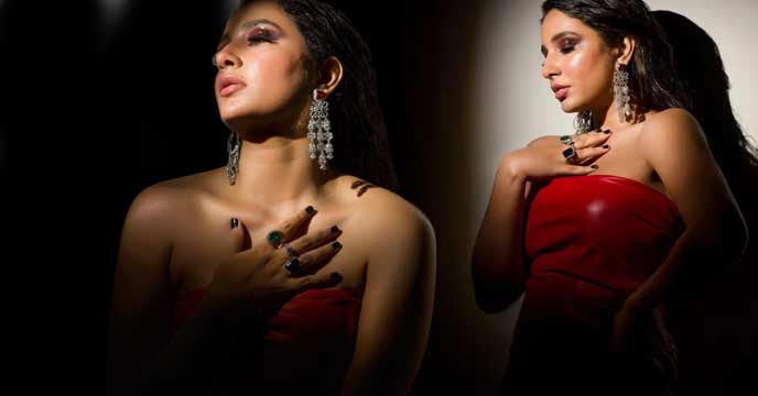 Actress Shubhashree Ganguly dancing in a red dress