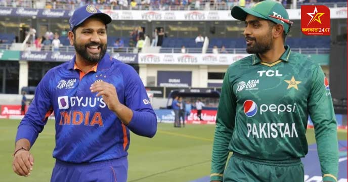 Rohit Sharma and Babar Azam shaking hands on the field