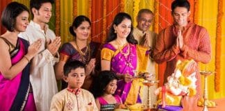 Akshaya Tritiya puja offerings with flowers, fruits, and sweets