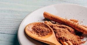 Cinnamon Powder on a Wooden Spoon