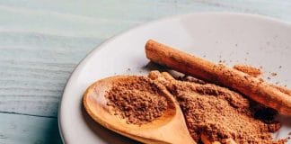 Cinnamon Powder on a Wooden Spoon