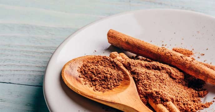 Cinnamon Powder on a Wooden Spoon