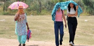 Girls walking in the scorching heat during a heatwave