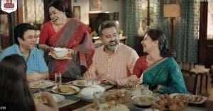 A bowl of cooked India Gate Basmati Rice on a wooden table