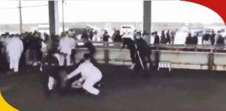 Japanese Prime Minister Kishida waving at a crowd