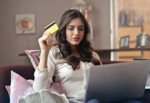 Woman shopping online with laptop and credit card