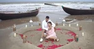 Pritam Kotal and his newlywed wife posing for a photo