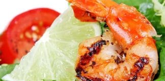 Plate of seafood including salmon, shrimp, and mussels