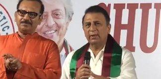 Sunil Gavaskar holding a cricket ball at ATK Mohun Bagan stadium