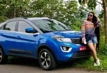 Girl posing with a Tata Nexon car