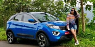 Girl posing with a Tata Nexon car