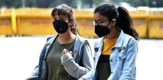 A girl wearing a mask to protect against COVID-19 in India