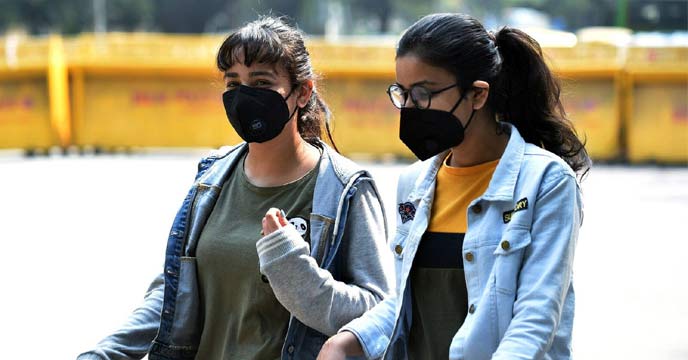 A girl wearing a mask to protect against COVID-19 in India