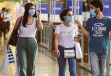 A medical professional taking a nasal swab for coronavirus test