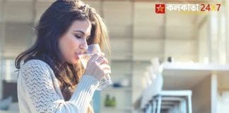 Person Drinking Cold Water From a Glass