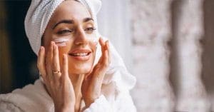 Indian girl applying sunscreen for effective skin care