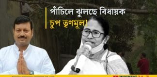 MLA Jibonkrishna Saha standing in front of the media