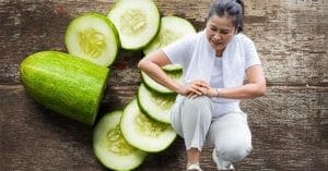 A bowl of fresh cucumbers on a wooden table