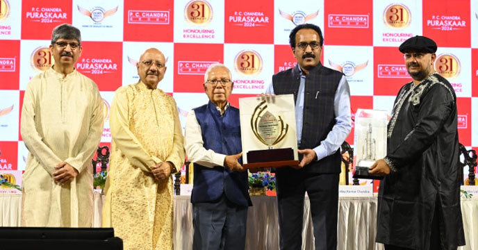 PC Chandra group honors ISRO chief with award